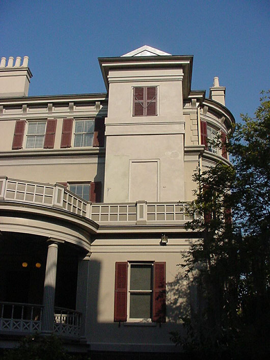 the birthplace with a new exterior side structure, housing an elevator
