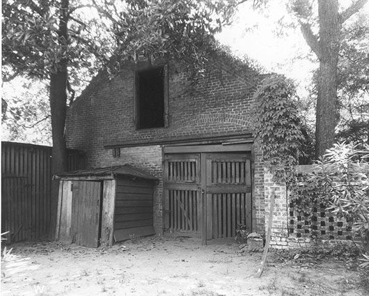 a run down brick carriage house on the gordon family property 
