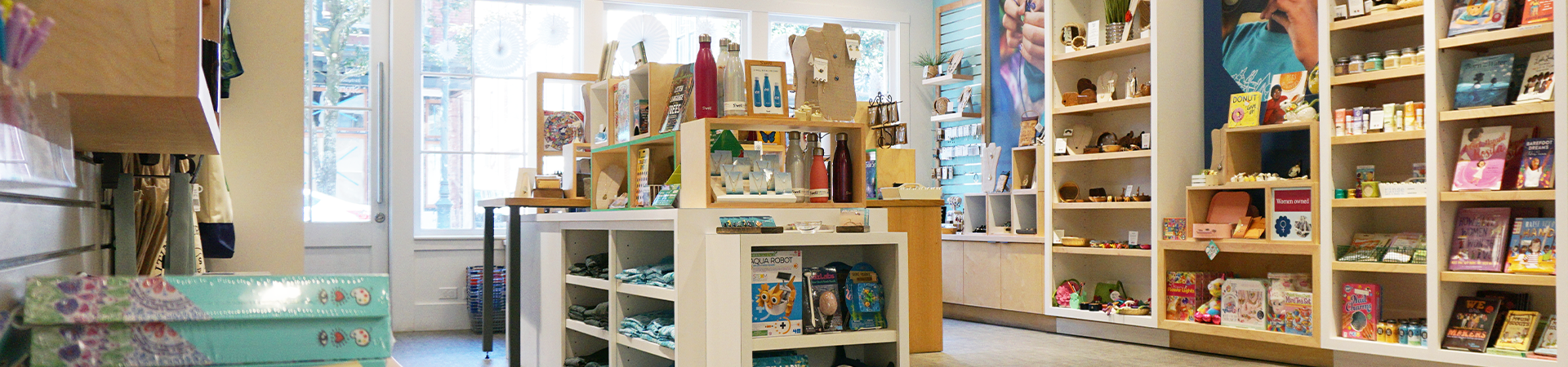  the museum gift shop with merchandise on shelves and tables 