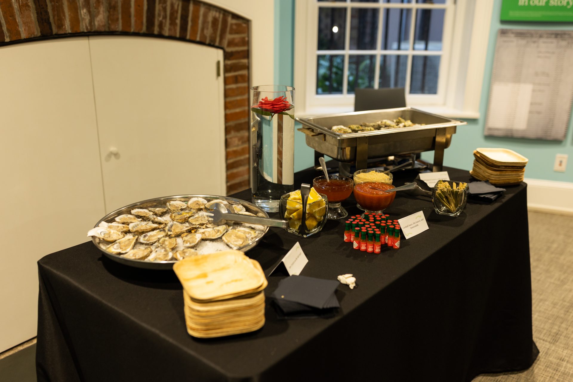 Oysters, condiments, lemon slices, and plates for guests to enjoy in the Orientation gallery.