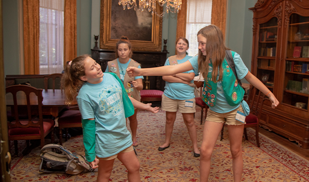 Junior Girl Scouts playing tableau in the back parlor.